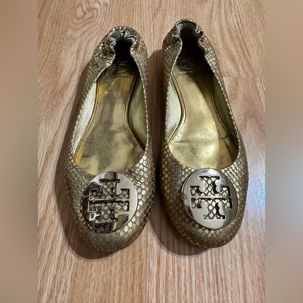Tory Burch ballet flats in gold snake print.